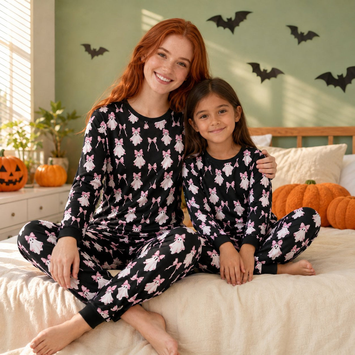 Lifestyle view of the family matching holiday pajamas with ghost design