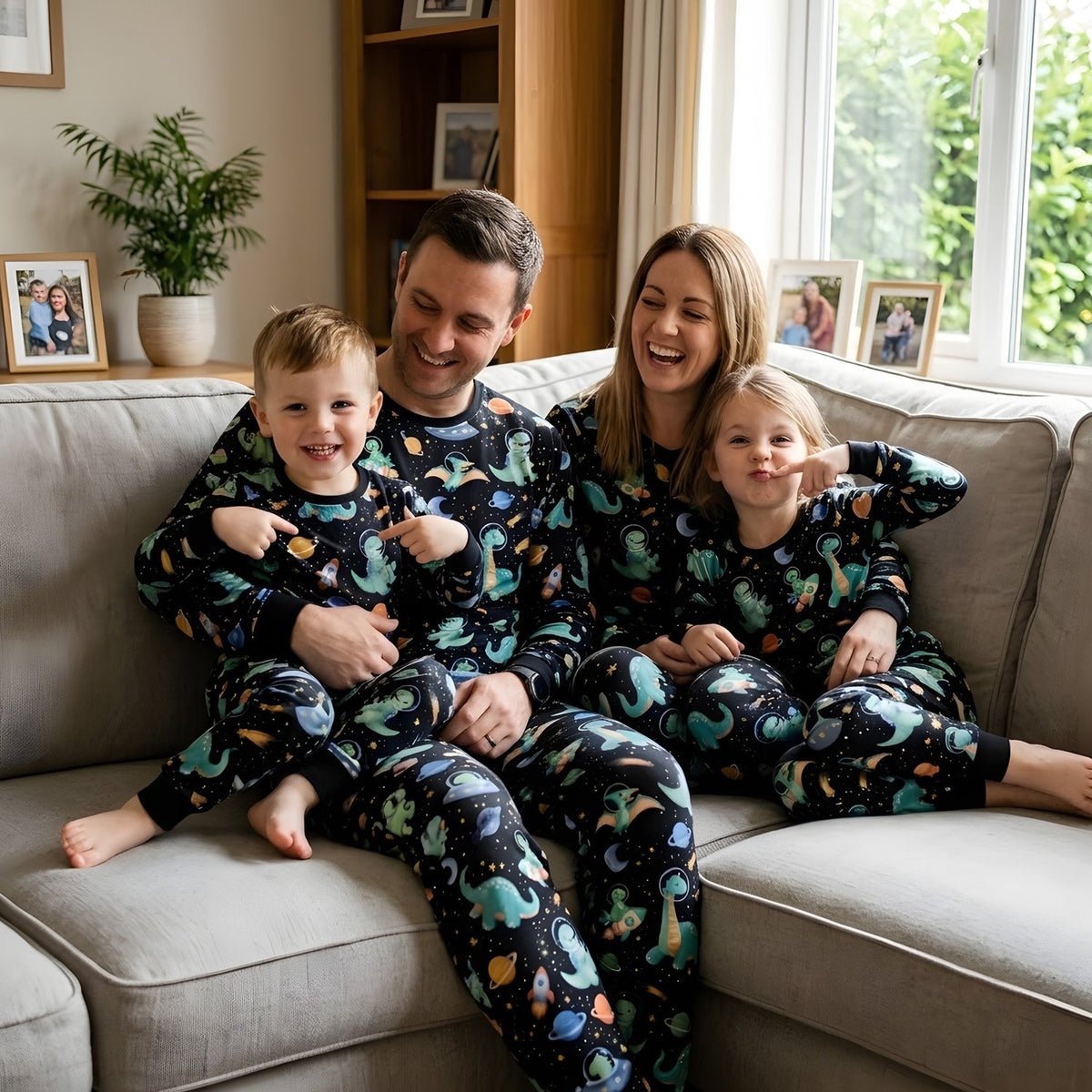 Lifestyle view showing the black space dinosaurs pajama set being worn