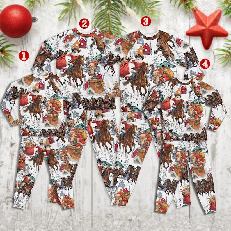 Four Western Santa print pajama sets laid flat in descending sizes, from adult down to toddler