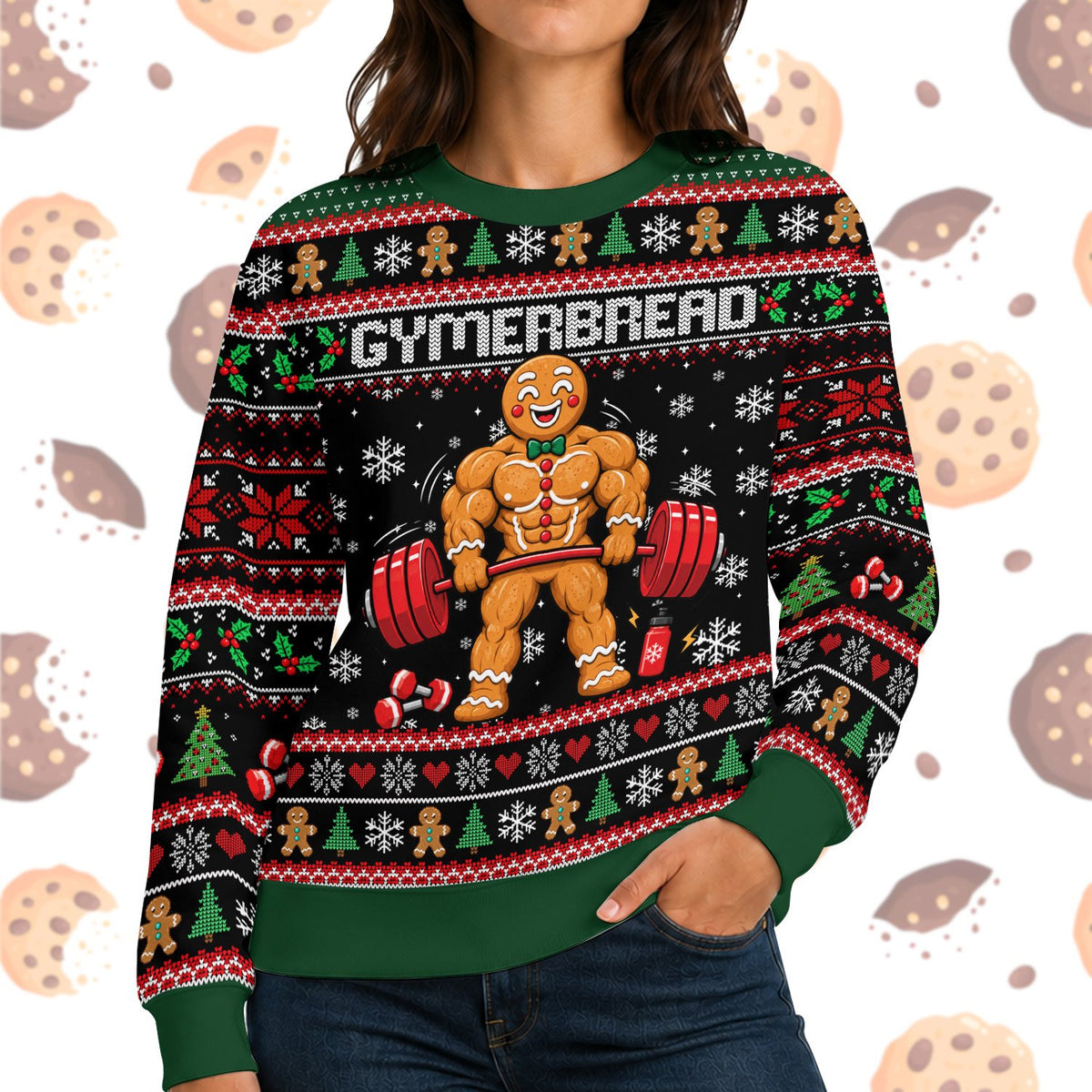 Woman wearing a black and green ugly Christmas sweater printed with a muscular gingerbread man lifting a barbell, captioned Gymerbread