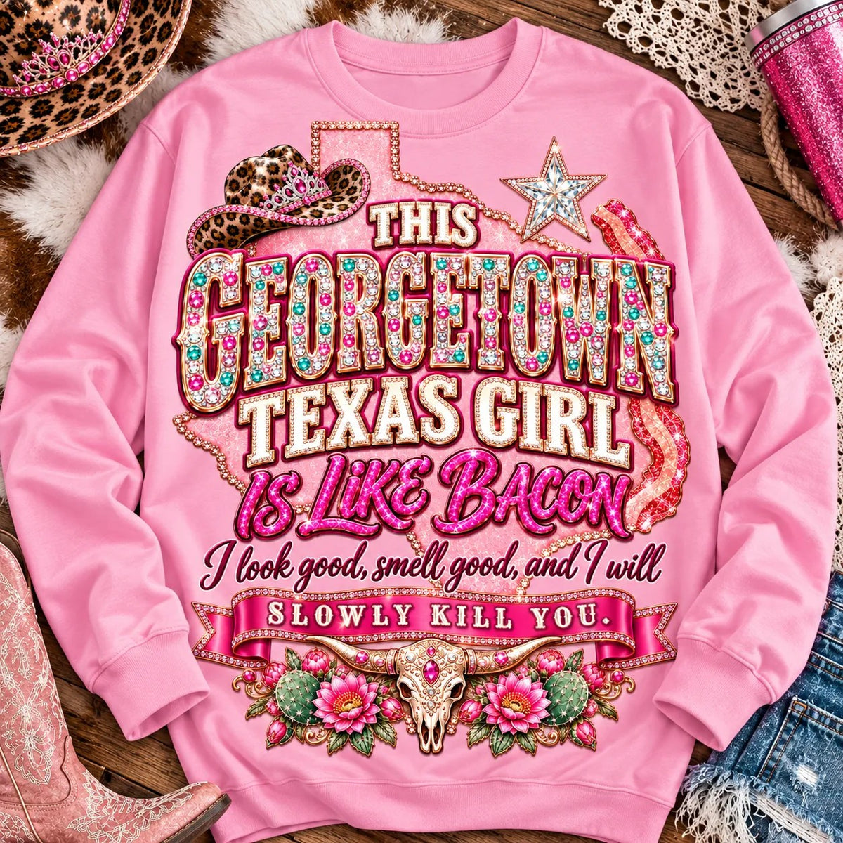 This Georgetown Texas Girl Is Like Bacon crewneck sweatshirt, pink rhinestone lettering, leopard cowgirl hat, Texas star, bacon and longhorn design on Light Pink