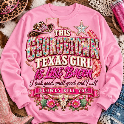 This Georgetown Texas Girl Is Like Bacon crewneck sweatshirt, pink rhinestone lettering, leopard cowgirl hat, Texas star, bacon and longhorn design on Light Pink