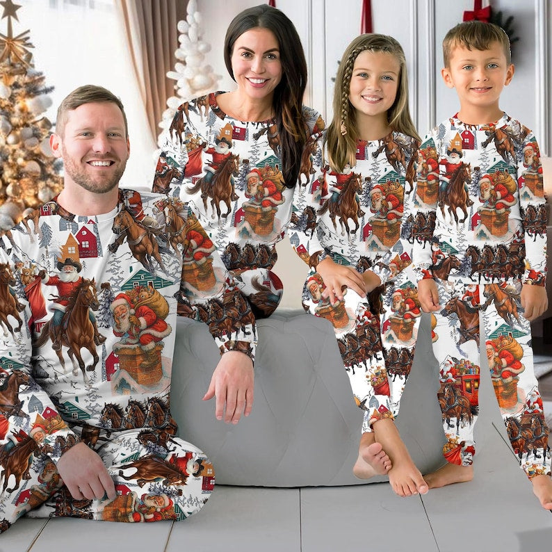 Family wearing matching Western Santa riding horse Christmas pajamas by the tree