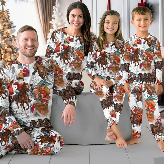 Family wearing matching Western Santa riding horse Christmas pajamas by the tree