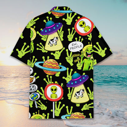 Group wearing matching family hawaiian shirts with alien design