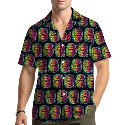 Lifestyle view of a person wearing the neon bigfoot hawaiian shirt outdoors