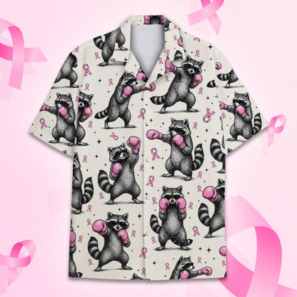 Matching family hawaiian shirts featuring raccoons with boxing gloves, flat lay view