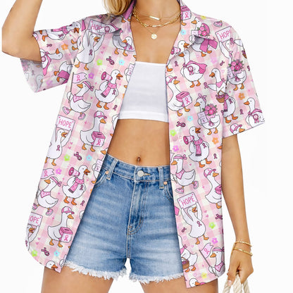 Lifestyle view showing an adult wearing the breast cancer awareness hawaiian shirt