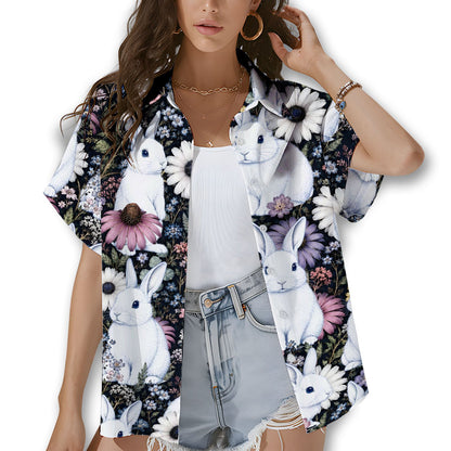 Lifestyle view of matching family hawaiian shirts in bunny floral design outdoors