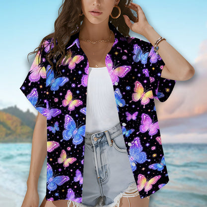 Person wearing the black butterflies hawaiian shirt showing the colorful stars and gems design