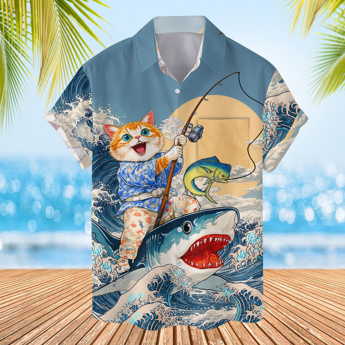Detailed front view of the cat riding a shark design on a blue hawaiian shirt