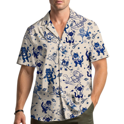 Close lifestyle shot of the beige and navy hockey hawaiian shirt