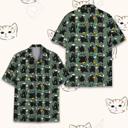 Front view of the black cat and pickleball design on a green hawaiian shirt