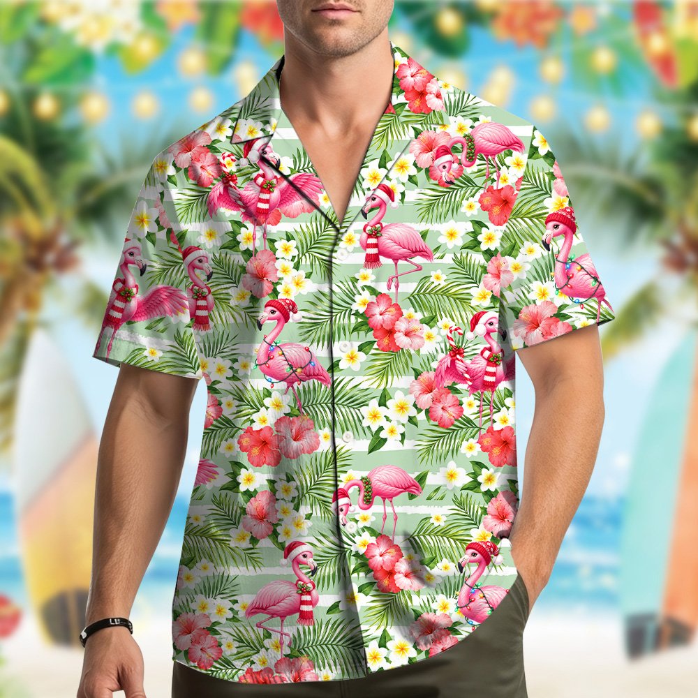 Close up front view of the light green and pink flamingo holiday shirt