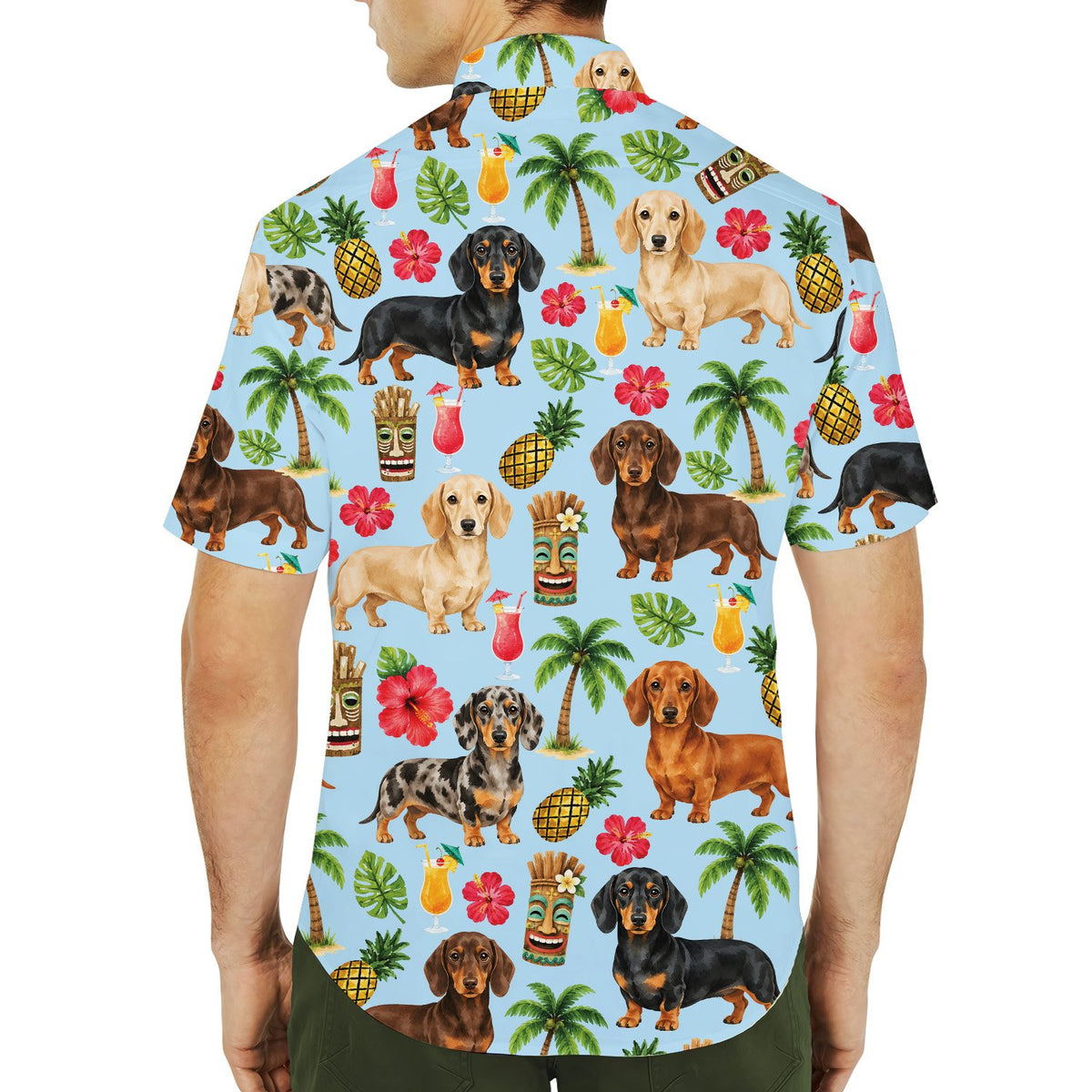 Another lifestyle image showing the dachshund tropical floral matching family Hawaiian shirts in a summer setting