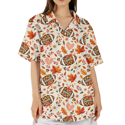 Lifestyle view of a family wearing matching fall football leopard hawaiian shirts