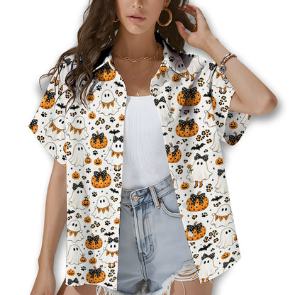 Family wearing matching Halloween ghosts and pumpkins hawaiian shirts outdoors
