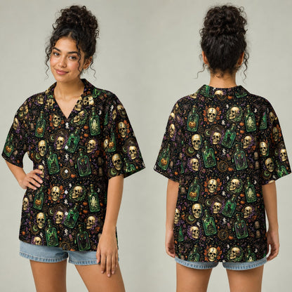 Close-up detail of the matching family hawaiian shirts featuring a potion bottle and spider webs