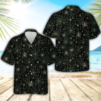 Close-up detail view of the halloween hawaiian shirt with green moons and stars on black