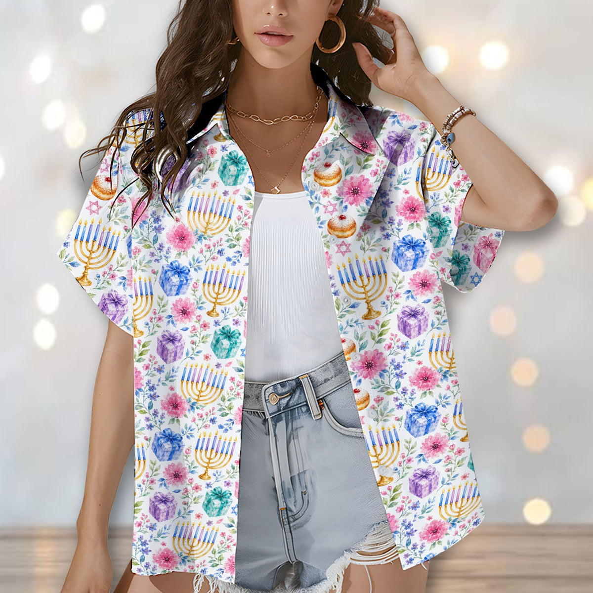 Close up lifestyle shot showing the dreidel and menorah pattern on the matching family hawaiian shirts