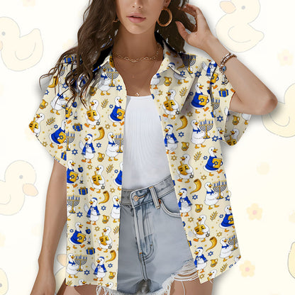 Person wearing beige hanukkah hawaiian shirt in a holiday setting