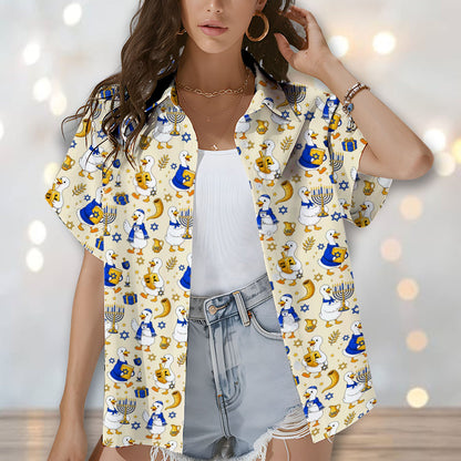 Close-up lifestyle shot of the hanukkah duck motif hawaiian shirt