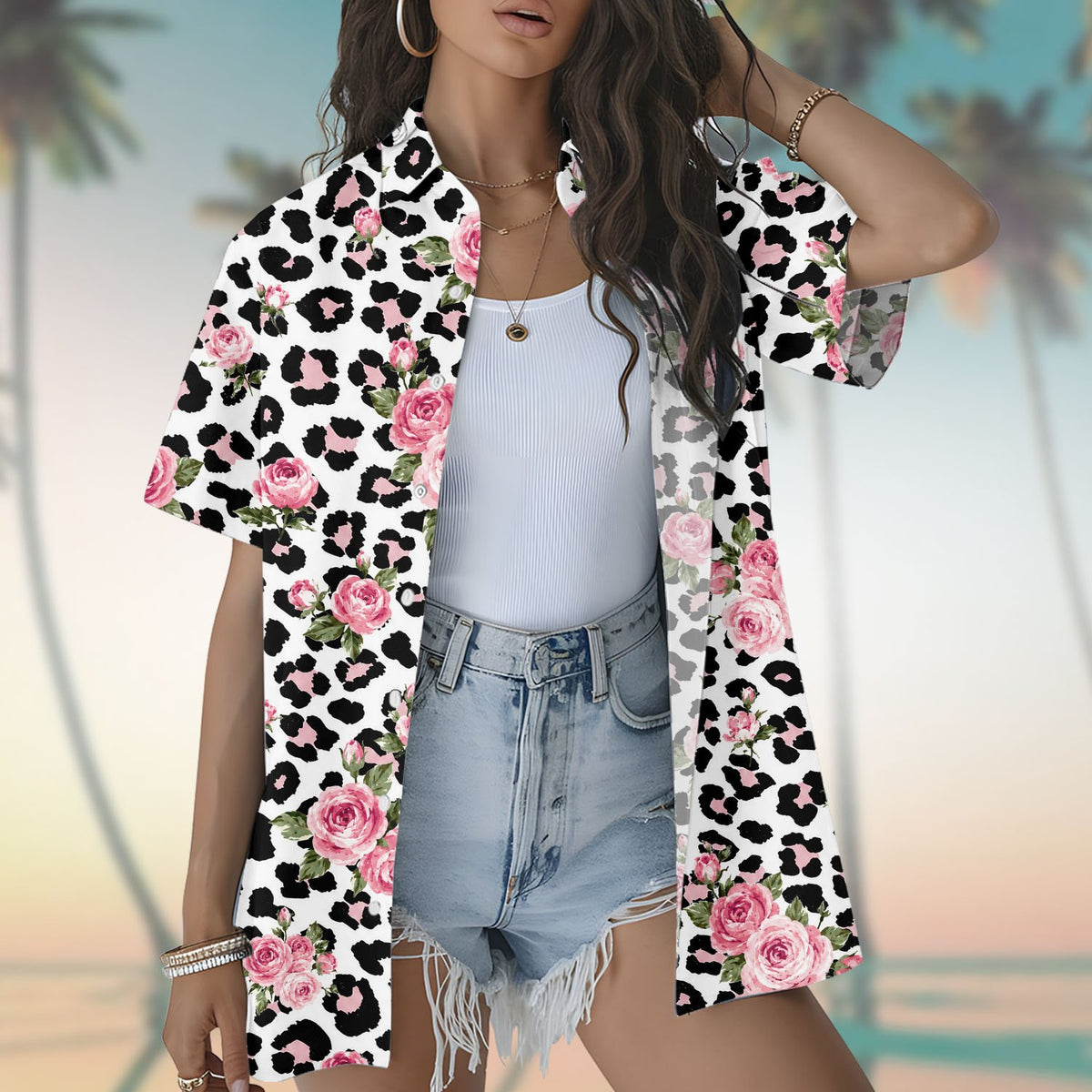 Person modeling the white leopard floral hawaiian shirt in a summer setting