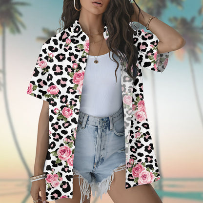 Person modeling the white leopard floral hawaiian shirt in a summer setting