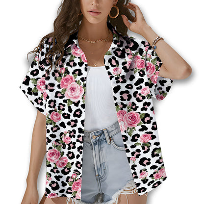 Lifestyle view of a person wearing the white leopard floral hawaiian shirt