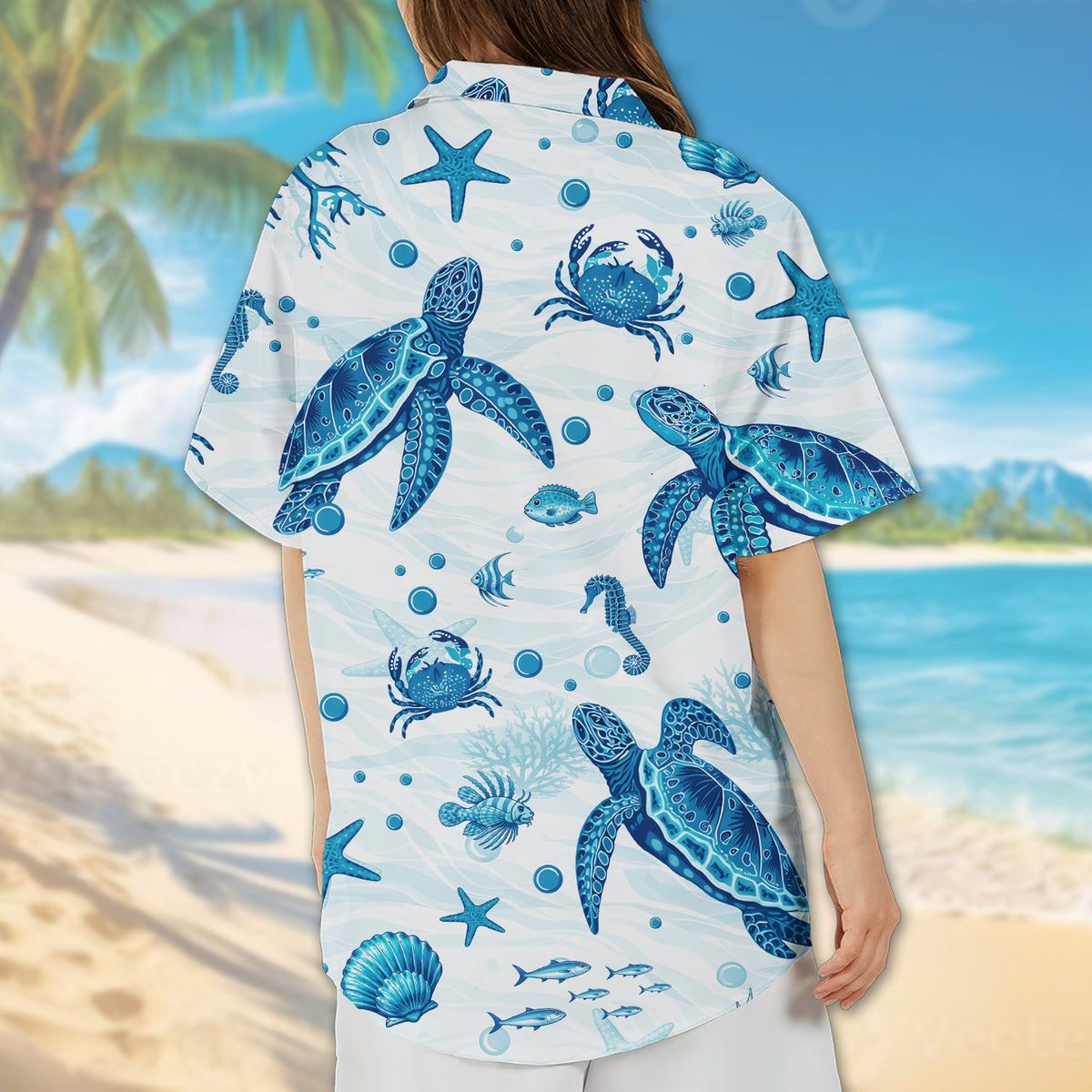 Lifestyle view of a family wearing matching family hawaiian shirts in a tropical setting