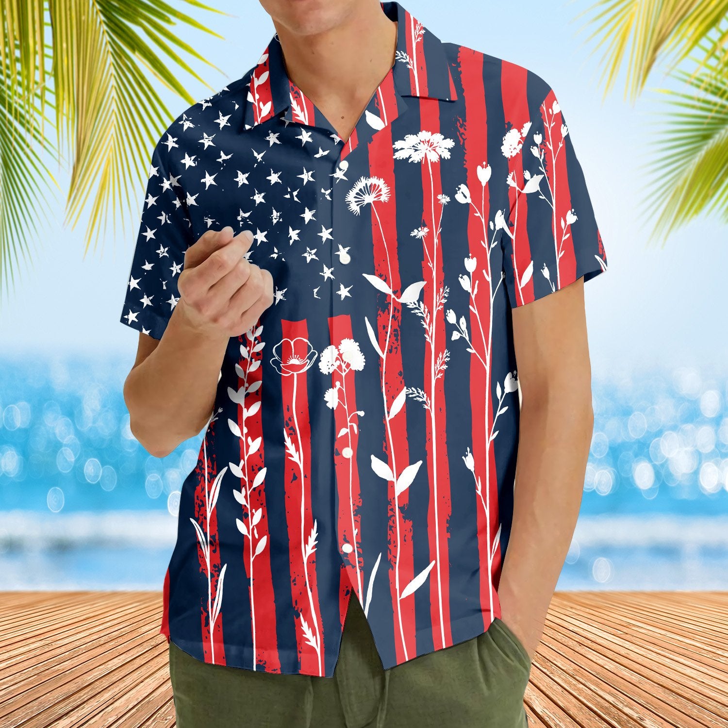 Lifestyle view of someone wearing the matching family hawaiian shirts in a patriotic floral design