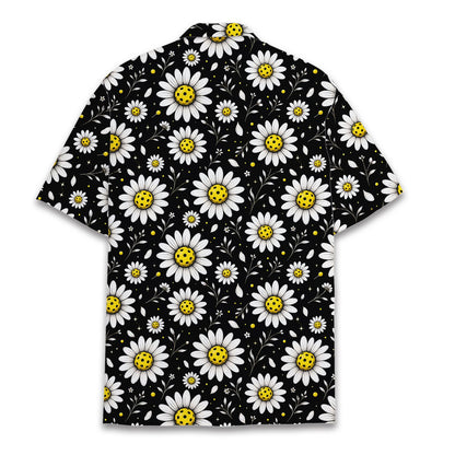 Detail view of the daisy and pickleball pattern on the hawaiian shirt