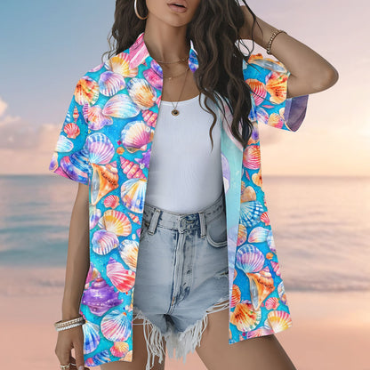 Person wearing the blue seashells hawaiian shirt near the beach