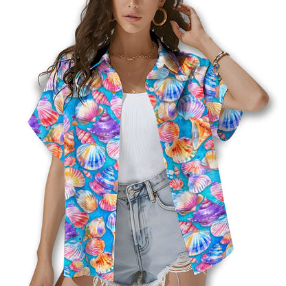 Family wearing matching family hawaiian shirts with seashell design, lifestyle view