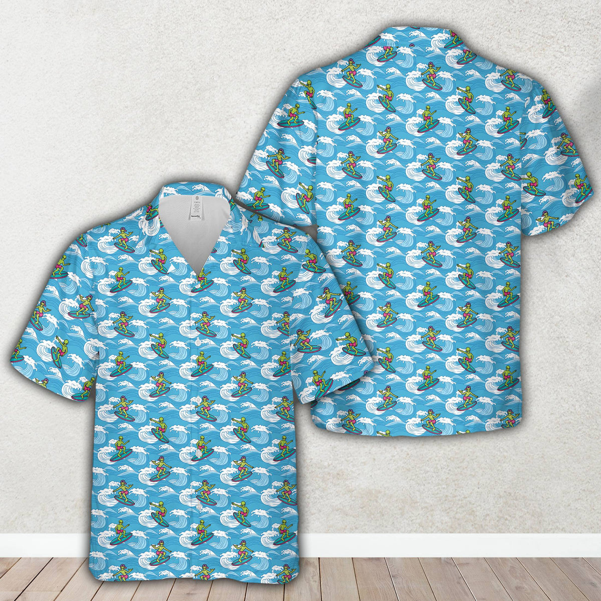 Detailed view of the surfing alien print on the hawaiian shirt