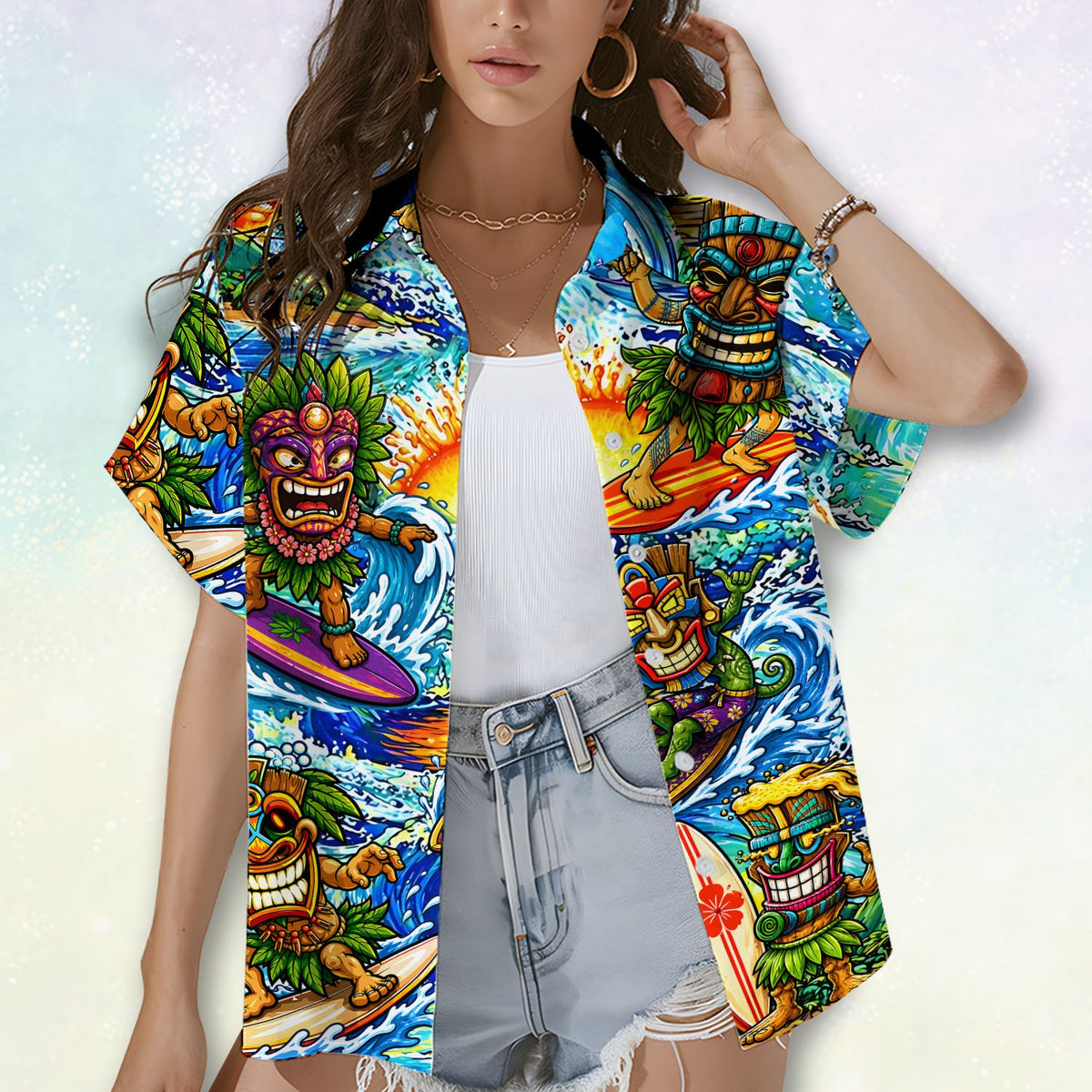Lifestyle shot displaying the vibrant blue tiki hawaiian shirt pattern outdoors