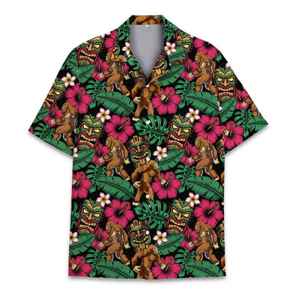 Tropical bigfoot tiki hawaiian shirt featuring pink hibiscus and tiki masks on black, main view