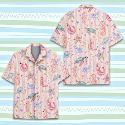 Lifestyle shot of a couple wearing the pink ocean hawaiian shirts