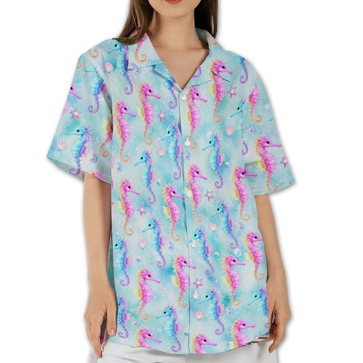 Detail showing the bright pink and blue seahorse pattern on the tropical hawaiian shirt