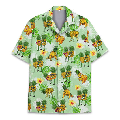 Tropical Hawaiian shirt featuring humorous pineapples on a light green background, front view