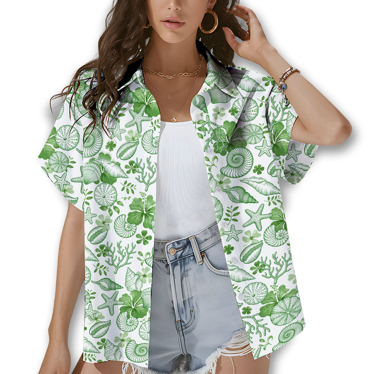 Family wearing matching white Hawaiian shirts with green seashells outdoors