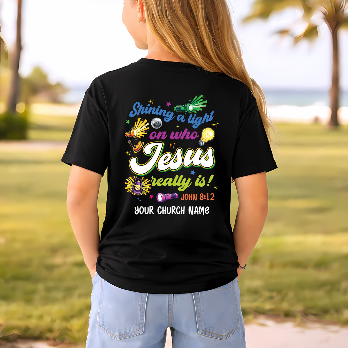 Front view of a personalized black faith t-shirt with retro illumination station graphics and custom text