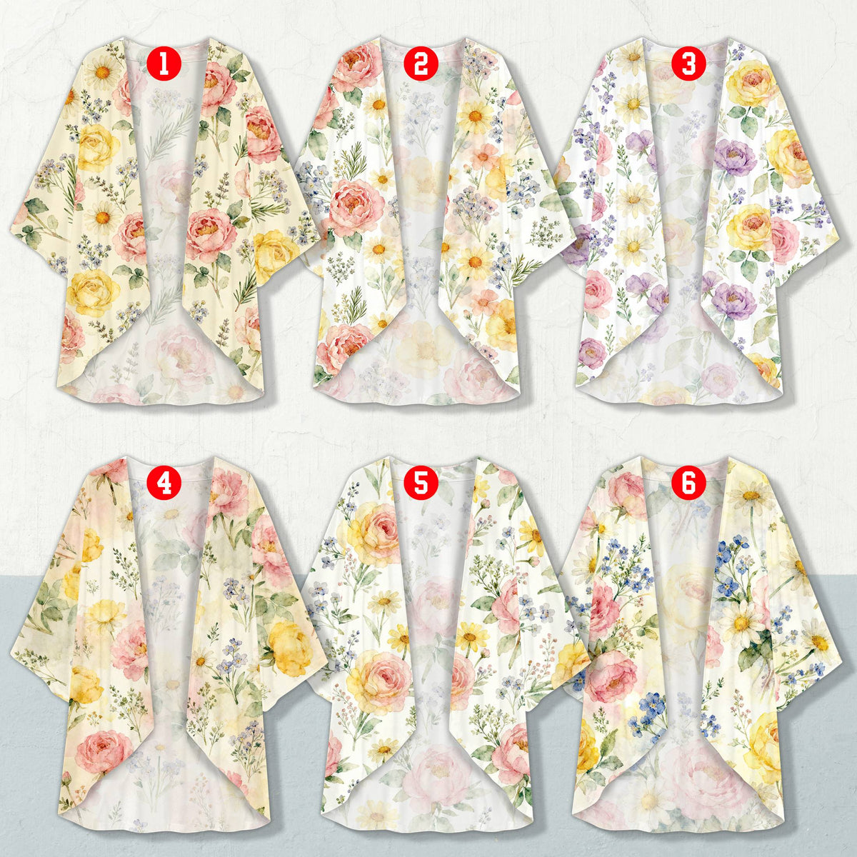 Close up of ladies floral cardigan showing pink and yellow watercolor flowers