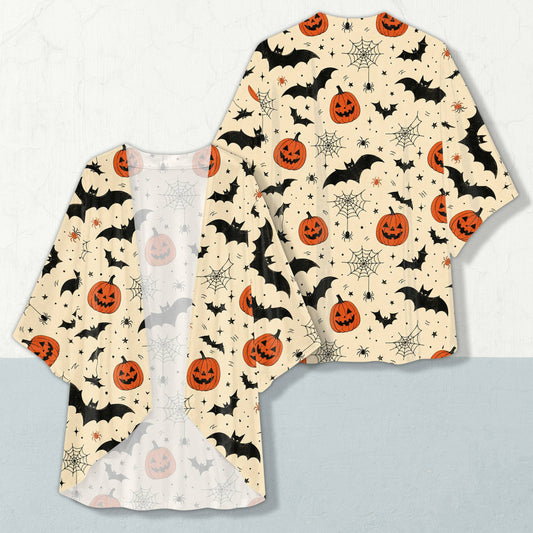 Halloween cardigan featuring black bats and orange pumpkins on a light beige background, front view