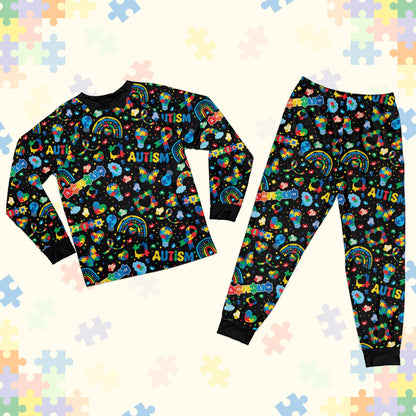 Black matching family pajamas featuring an autism awareness pajama set design with colorful puzzle pieces, main view