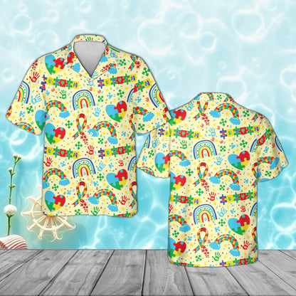 Yellow autism awareness pajama set with puzzle piece hearts and rainbows, front view