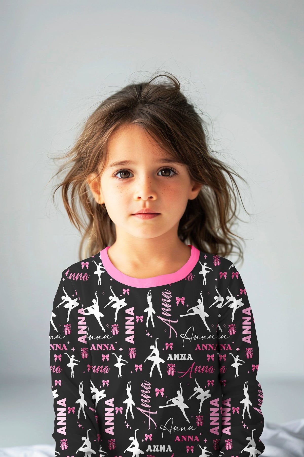 Lifestyle view of a child wearing the personalized ballet pajama set