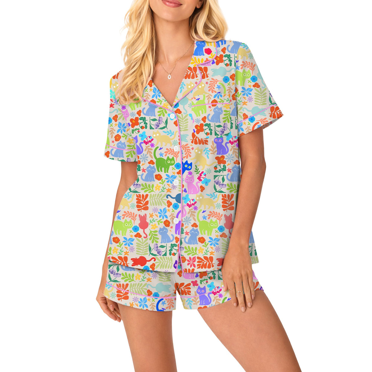 Front view of the matching family pajamas displaying vibrant cat and botanical designs.