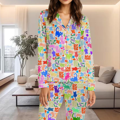 Final lifestyle view of the vibrant cats and botanical pajama set.