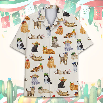 Cats in hats pajama set showing a repeating pattern on cream fabric